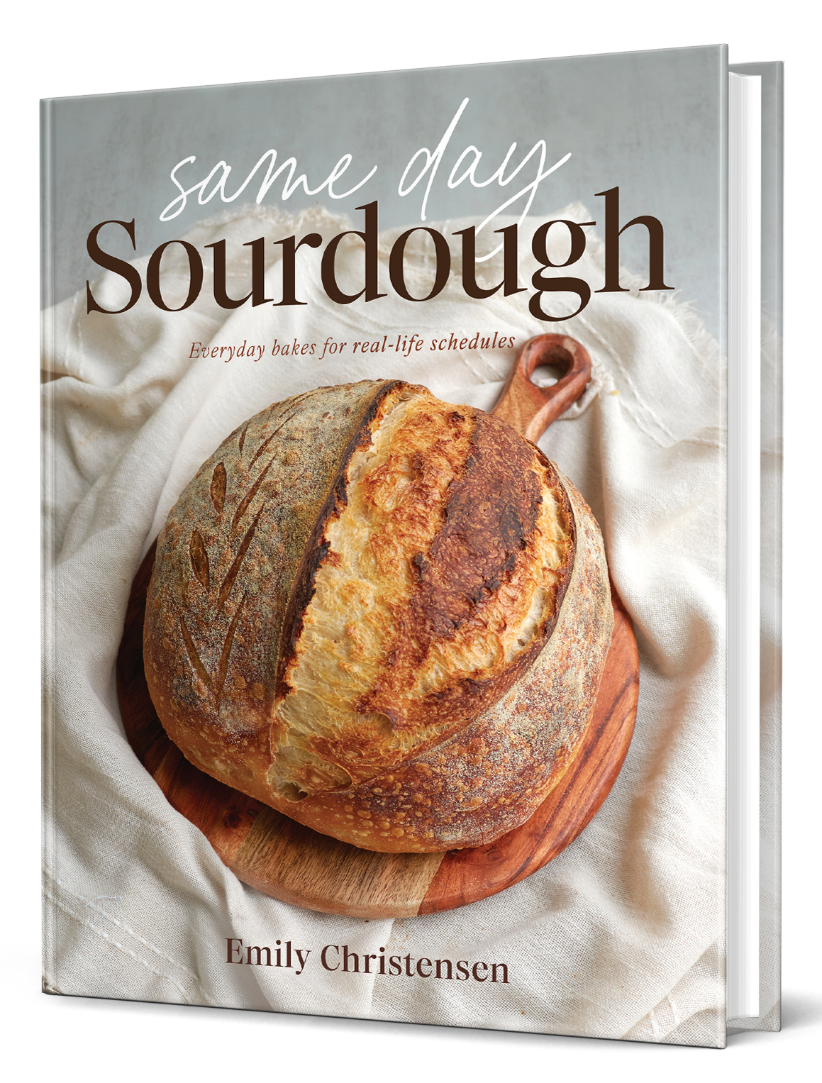 Book titled 'Same Day Sourdough' by Emily Christensen with a loaf of bread on the cover.