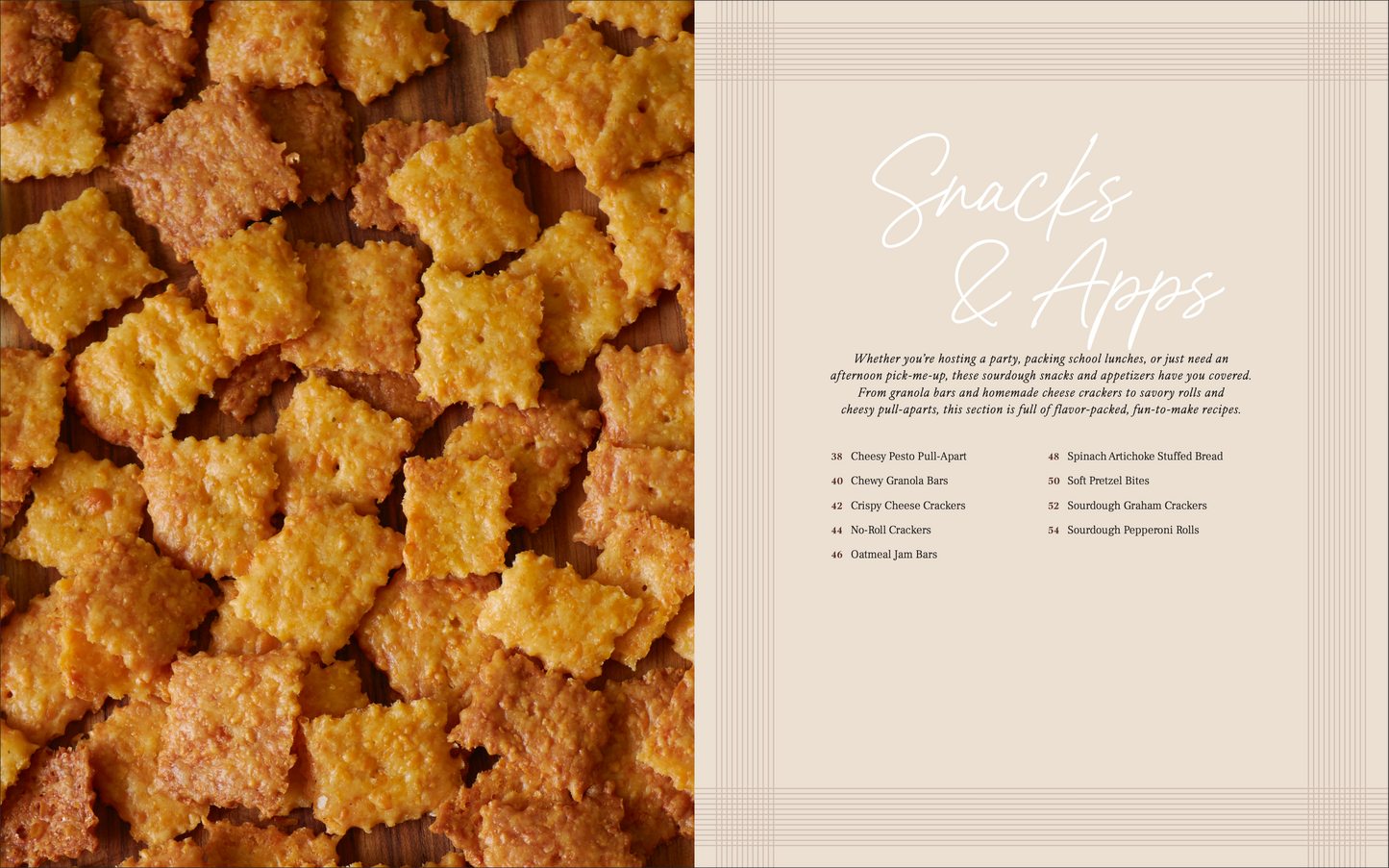 Close-up of square-shaped sourdough cheese crackers on a wooden surface with text on the right side for snacks & apps section of same day sourdough cookbook.